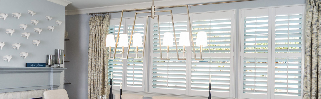 White plantation shutters in a kitchen.